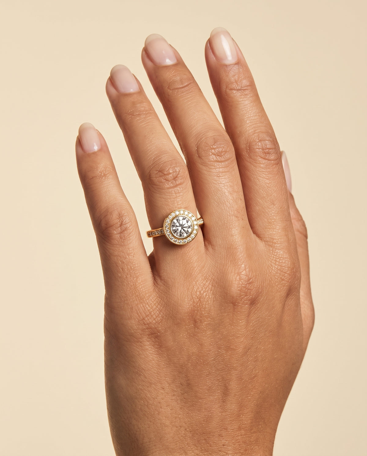 The Marcia Bezel Halo Channel Band Round Engagement Ring Setting in 18K Yellow Gold