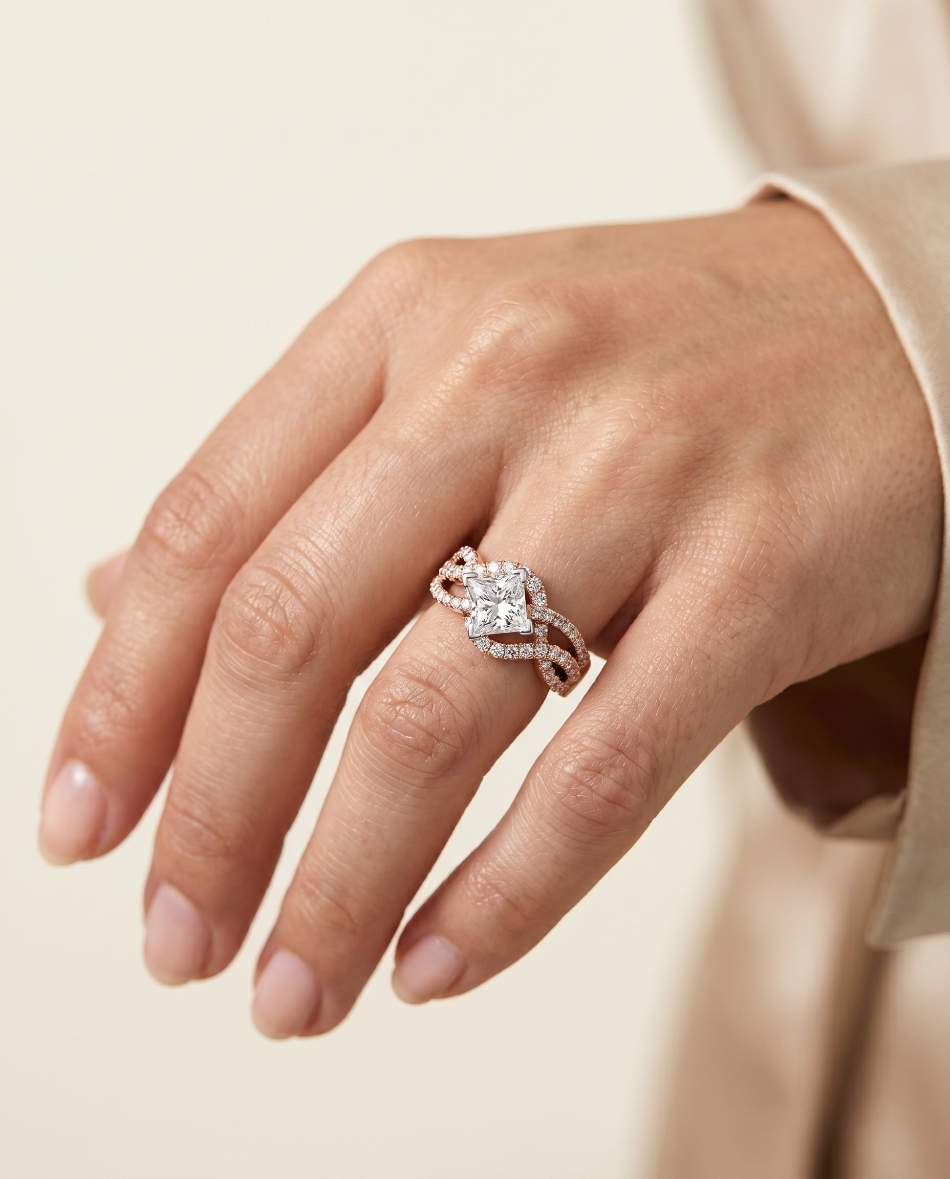 The Marguerite engagement ring setting in 14K Rose Gold, bypass twist pavé swirl design | RockHer