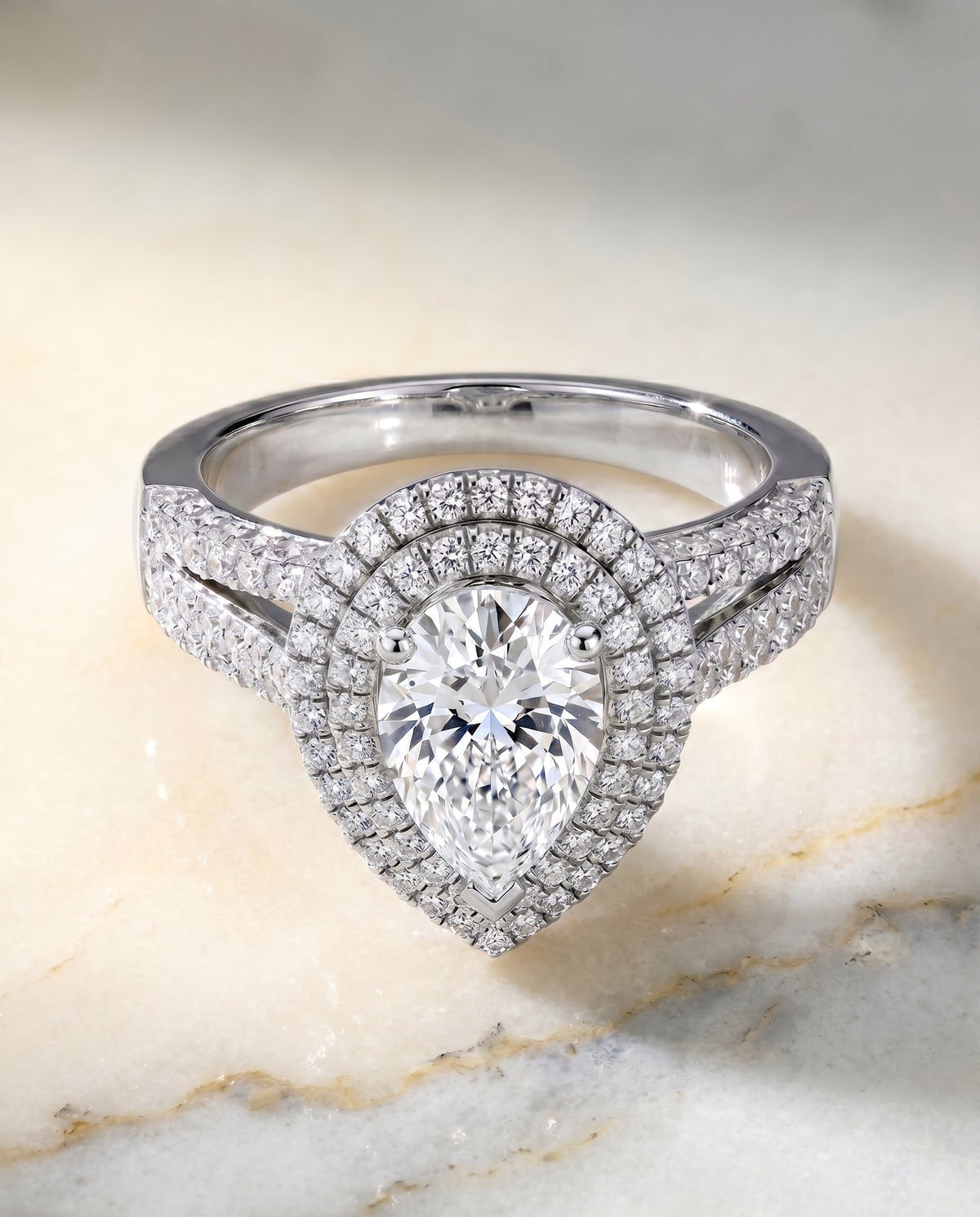 Mariah Select Halo Pear Lab Diamond Engagement Ring in Platinum, shown on hand, angled | RockHer