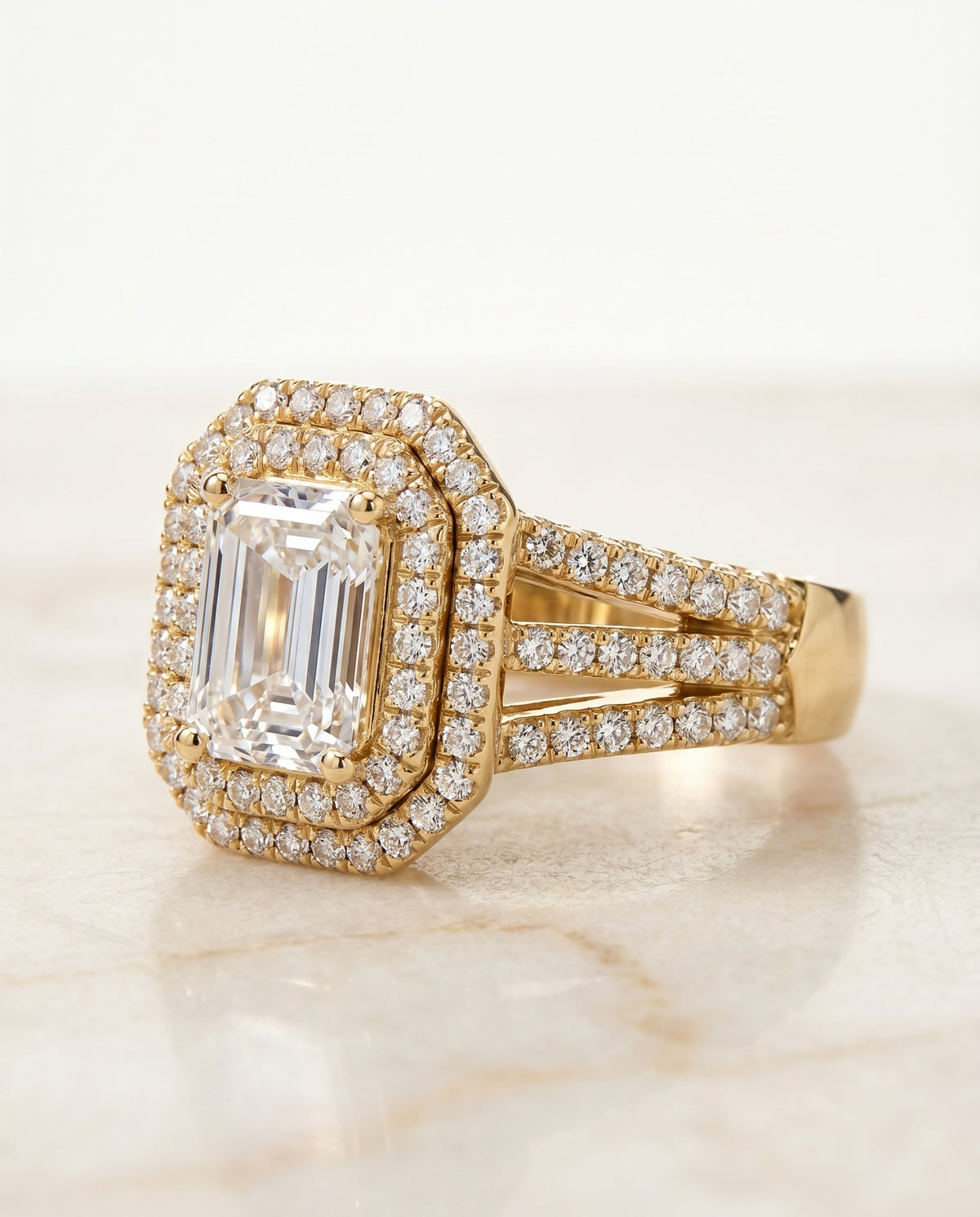 Mariah Select Halo Emerald Cut Lab Diamond Engagement Ring in 18K Yellow Gold, shown on hand, angled | RockHer