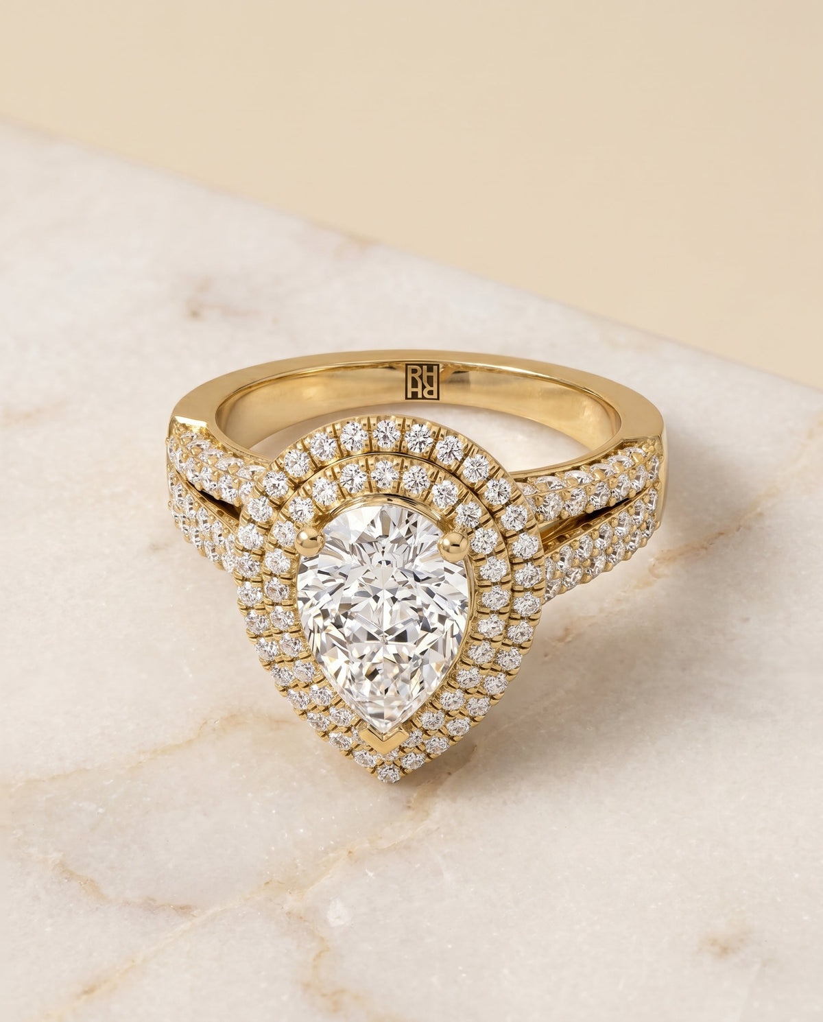 Mariah Select Halo Pear Lab Diamond Engagement Ring in 18K Yellow Gold, shown on hand, angled | RockHer