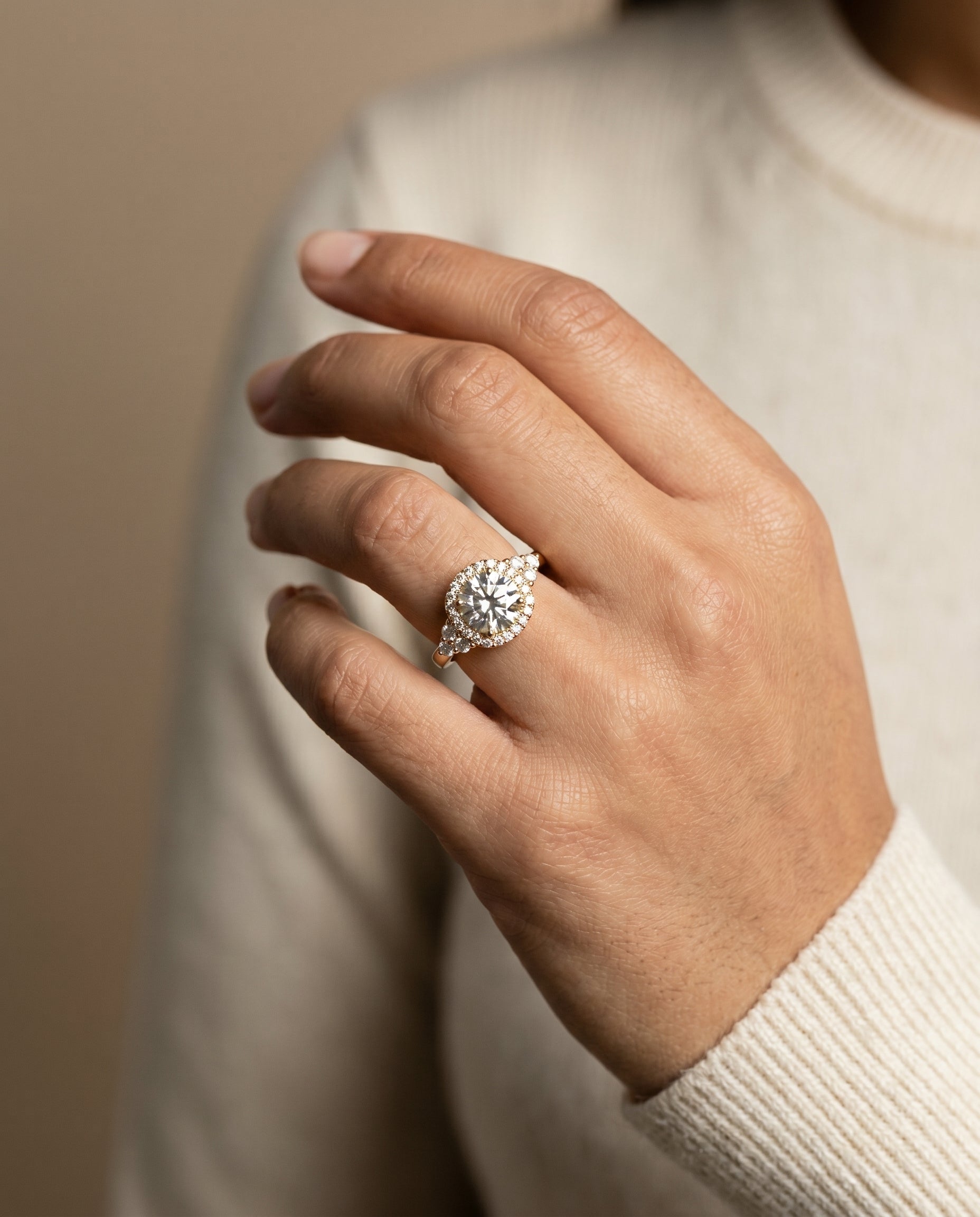 Melisma Select Open Twisted Triple Halo Round Lab Diamond Engagement Ring in 18K Yellow Gold, shown on hand | RockHer
