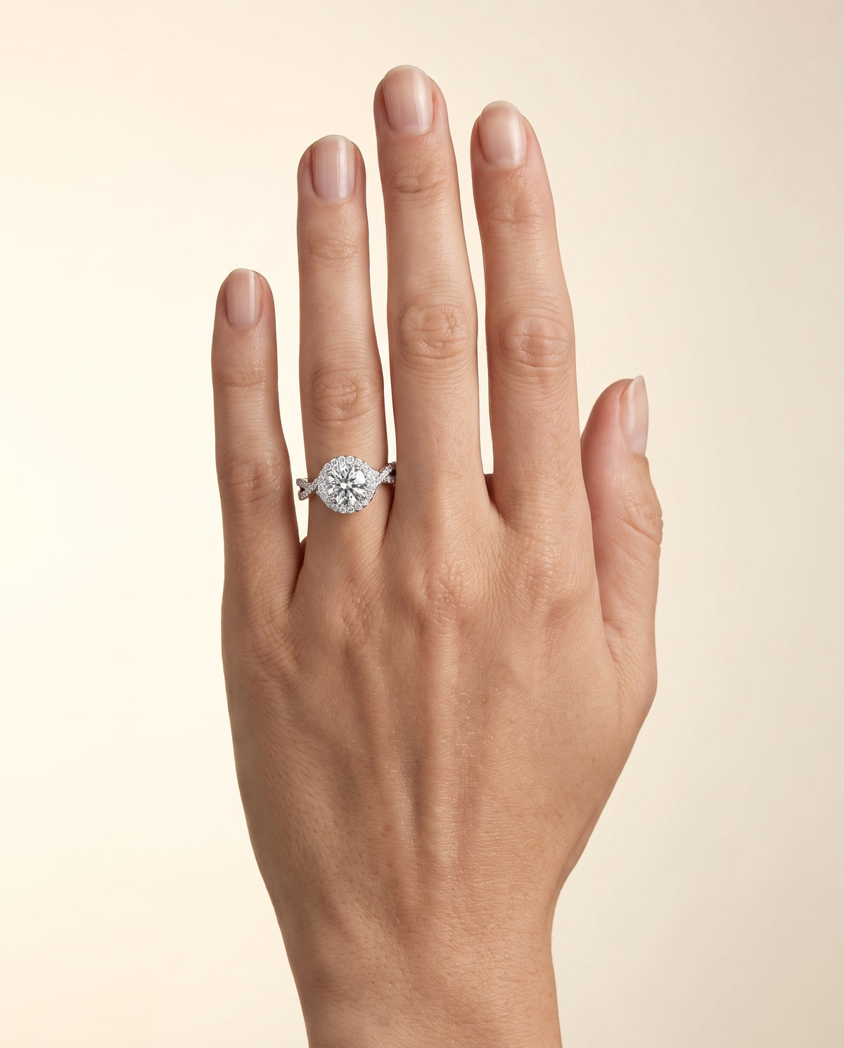 The Melody Twisted Lattice Halo Round Engagement Ring Setting in 18K White Gold