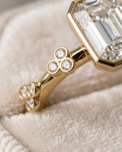 The Miley Clover Bezel Accent Solitaire Emerald Cut Engagement Ring Setting in 18K Yellow Gold