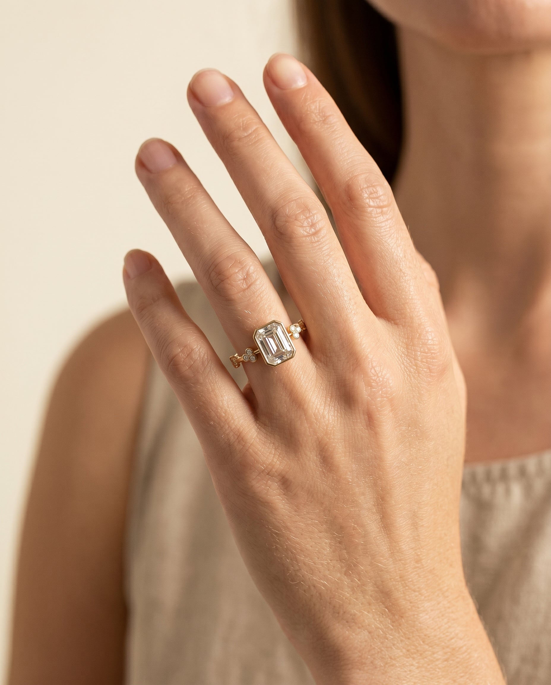 The Miley engagement ring setting in 18K Yellow Gold, clover bezel accent solitaire cut design | RockHer