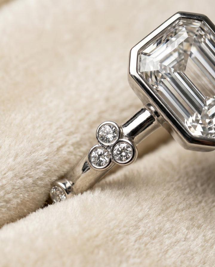 The Miley Clover Bezel Accent Solitaire Emerald Cut Engagement Ring Setting in Platinum