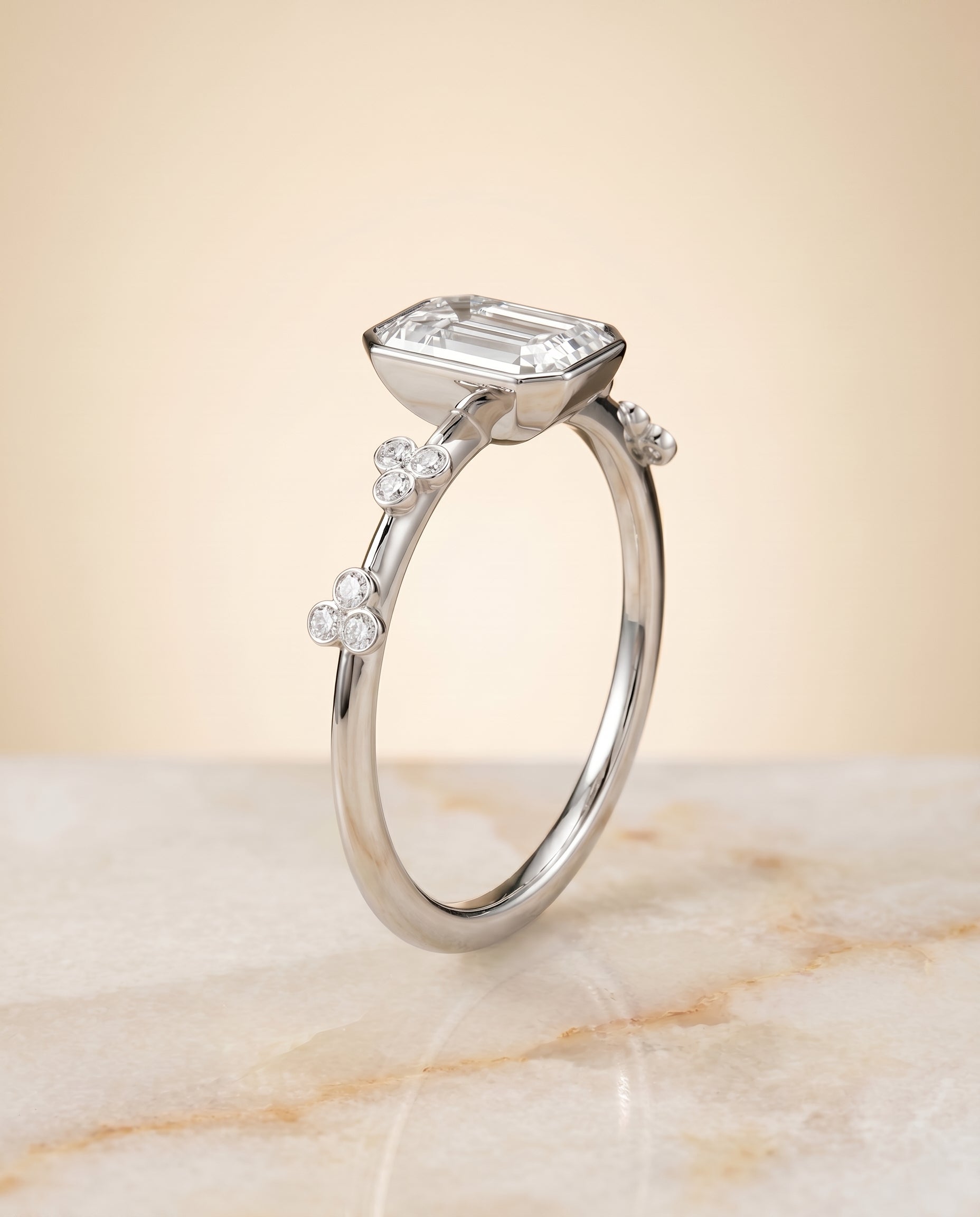 Clover Bezel Accent Solitaire Cut styling on The Miley emerald engagement ring setting | RockHer