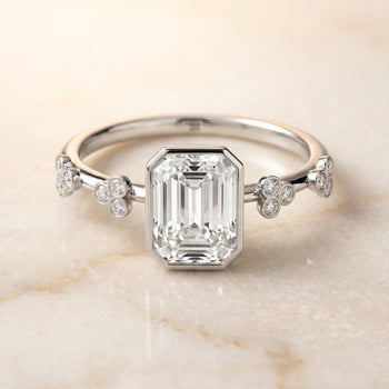 The Miley Clover Bezel Accent Solitaire Emerald Cut Engagement Ring Setting in Platinum