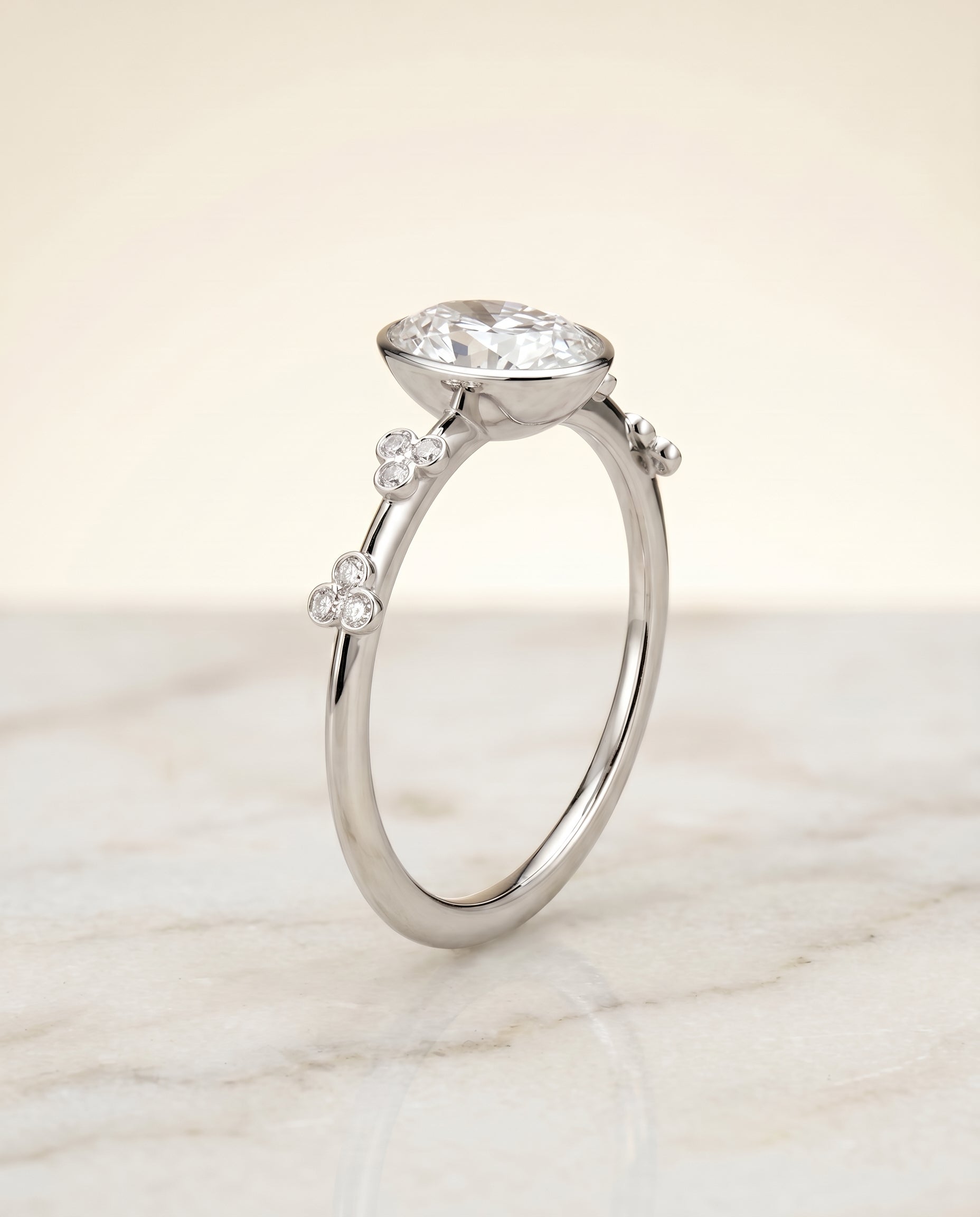 Clover Bezel Accent Solitaire styling on The Miley oval engagement ring setting | RockHer