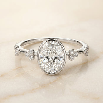 The Miley Clover Bezel Accent Solitaire Oval Engagement Ring Setting in 18K White Gold