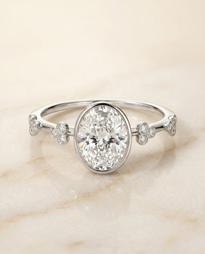 The Miley Clover Bezel Accent Solitaire Oval Engagement Ring Setting in 18K White Gold