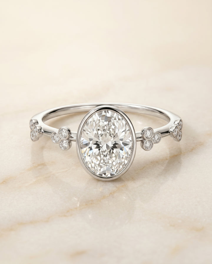The Miley Clover Bezel Accent Solitaire Oval Engagement Ring Setting in 18K White Gold
