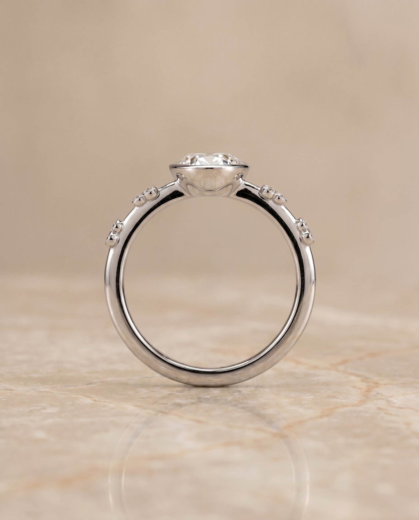 The Miley Bezel Solitaire Engagement Ring Setting for Oval Diamonds in 18K White Gold