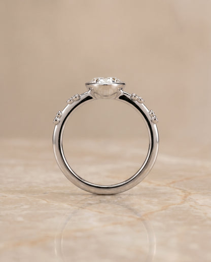 The Miley Clover Bezel Accent Solitaire Oval Engagement Ring Setting in 18K White Gold
