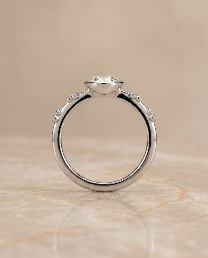 The Miley Bezel Solitaire Engagement Ring Setting for Oval Diamonds in 18K White Gold