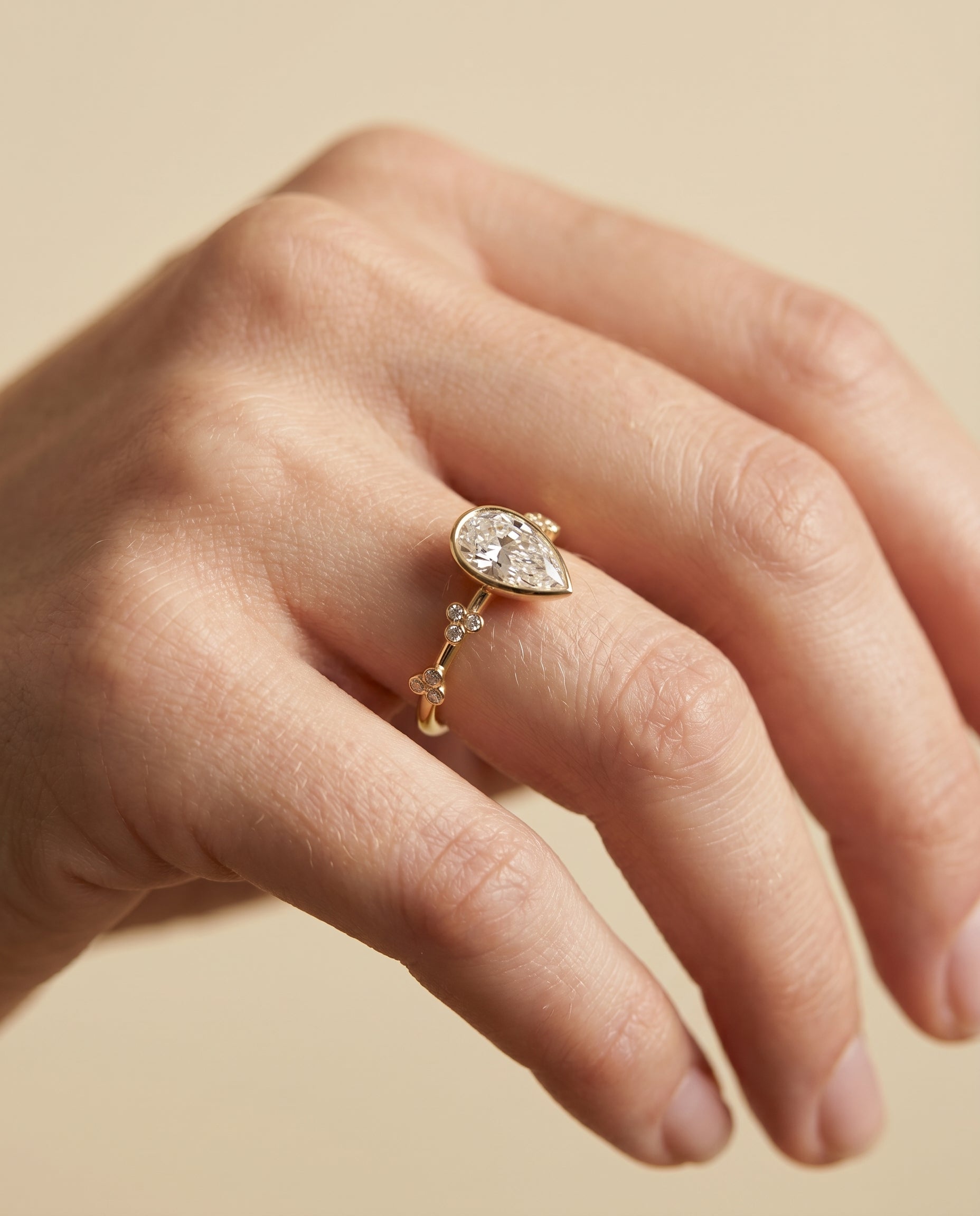 The Miley engagement ring setting in 18K Yellow Gold, clover bezel accent solitaire design | RockHer