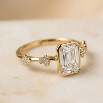 The Miley Clover Bezel Accent Solitaire Radiant Cut Engagement Ring Setting in 18K Yellow Gold