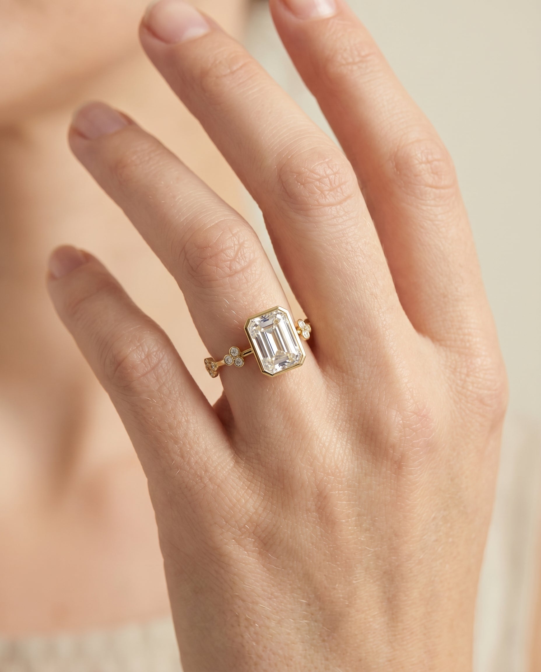 The Miley engagement ring setting in 18K Yellow Gold, clover bezel accent solitaire cut design | RockHer