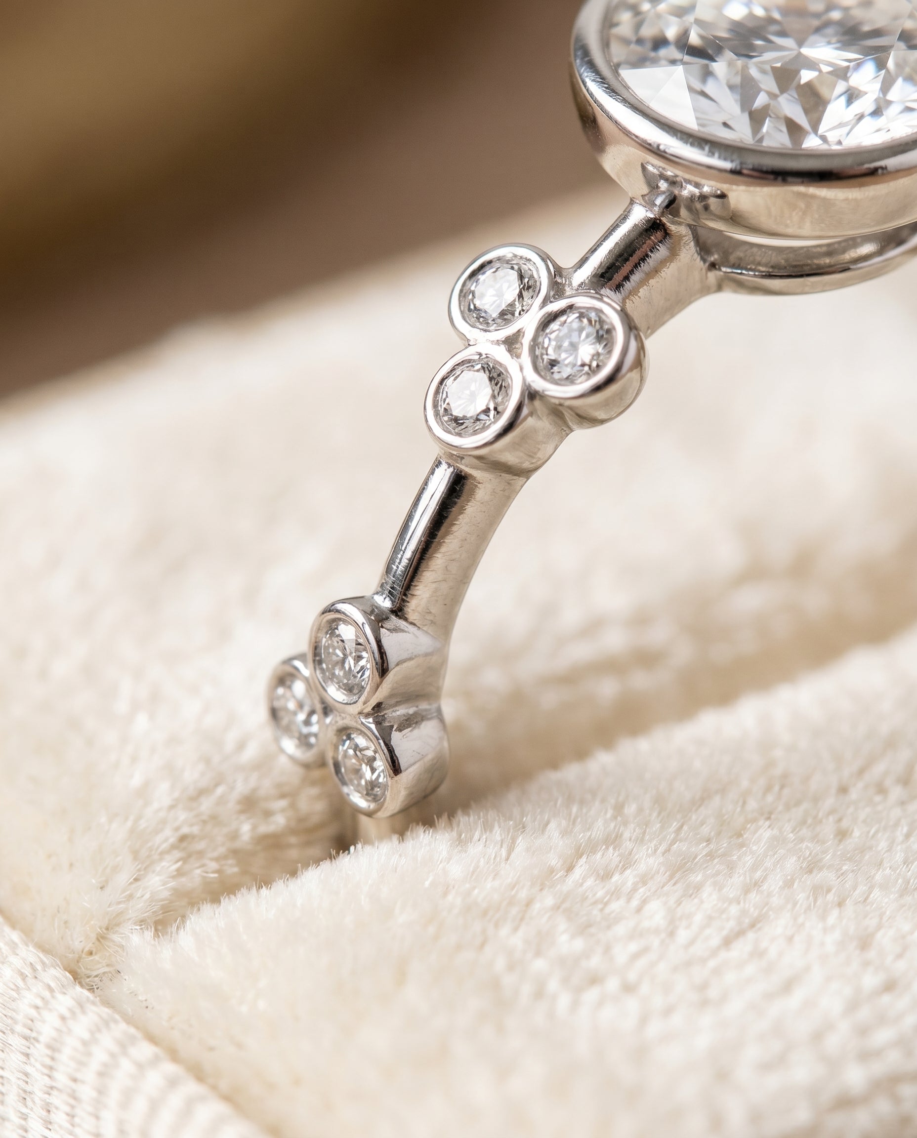 Miley Select Clover Bezel Accent Solitaire Round Lab Diamond Engagement Ring in 18K White Gold, detail view | RockHer