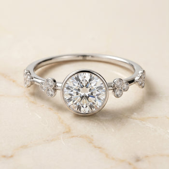 The Miley Clover Bezel Accent Solitaire Round Engagement Ring Setting in Platinum