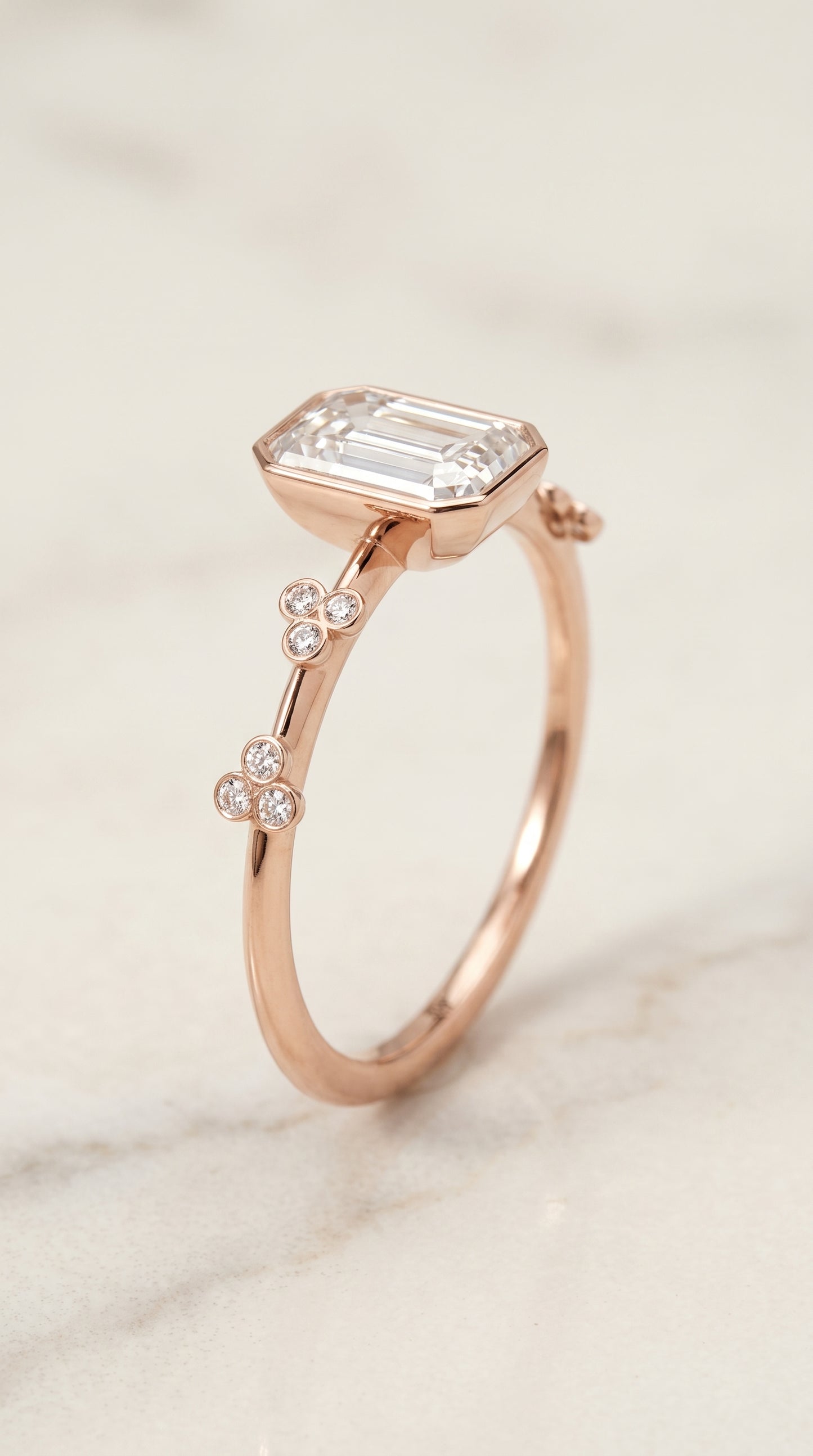 The Miley Clover Bezel Accent Solitaire Emerald Cut Engagement Ring Setting in 14K Rose Gold