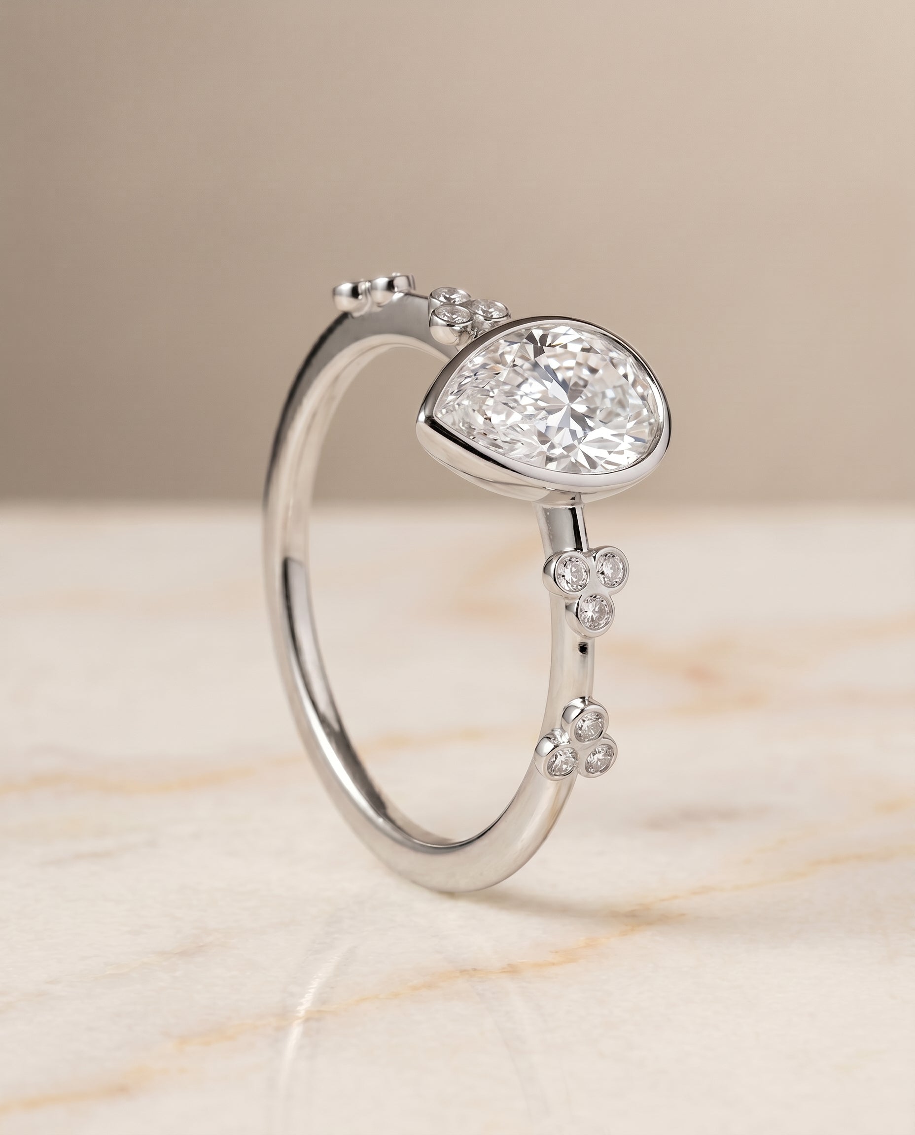 Clover Bezel Accent Solitaire styling on The Miley princess engagement ring setting | RockHer