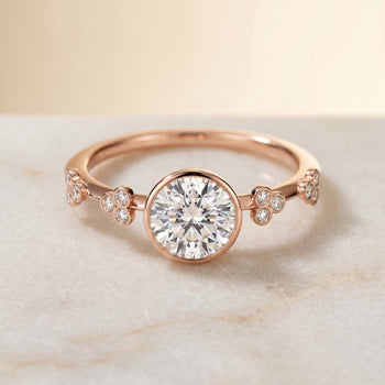 The Miley Clover Bezel Accent Solitaire Round Engagement Ring Setting in 14K Rose Gold