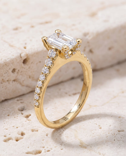 The Mimi Graduated Linear Pavé Emerald Cut Engagement Ring Setting in 18K Yellow Gold