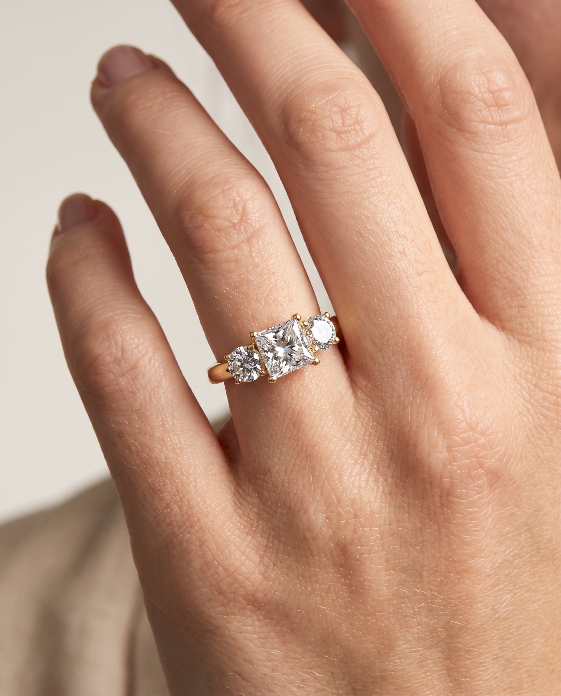The Natalie engagement ring setting in 18K Yellow Gold, classic three stone design | RockHer