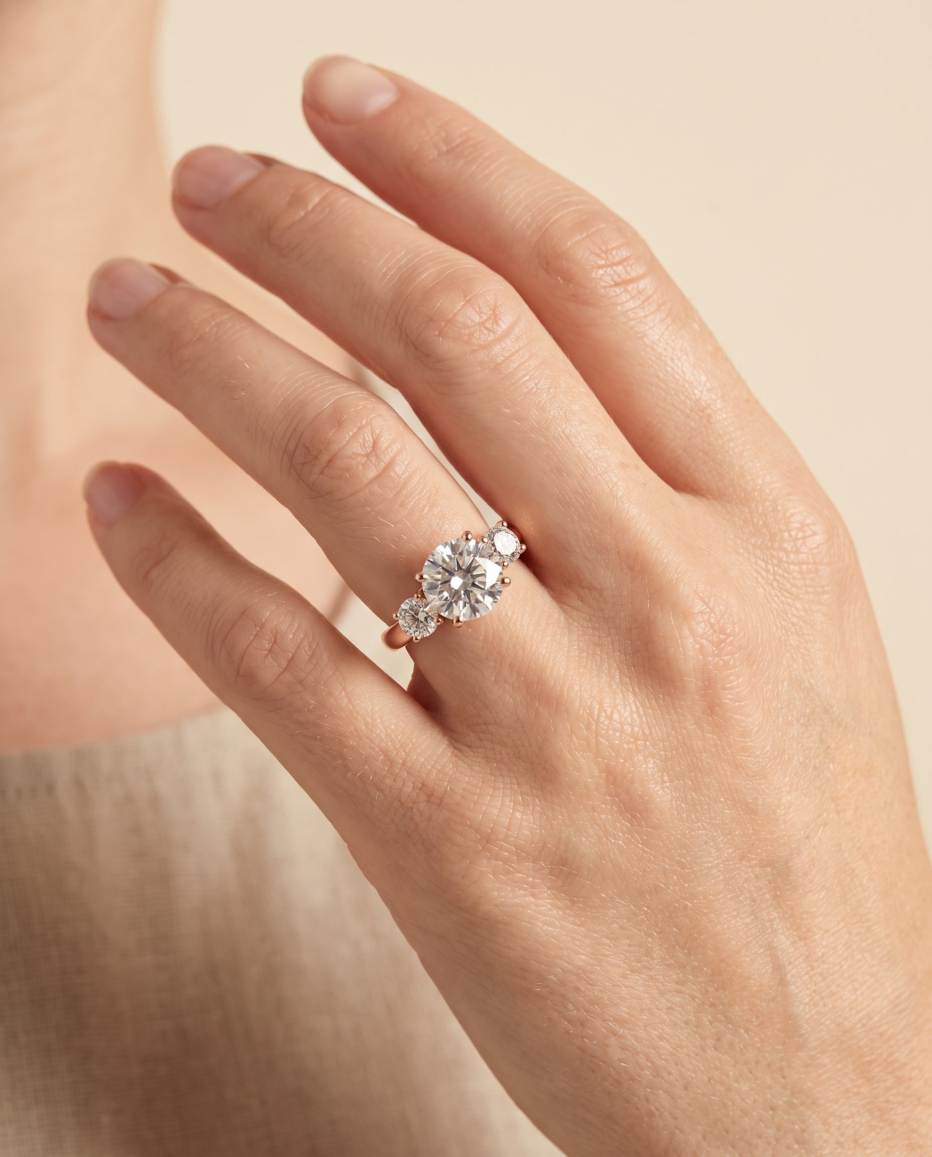 The Natalie engagement ring setting in 14K Rose Gold, classic three stone design | RockHer