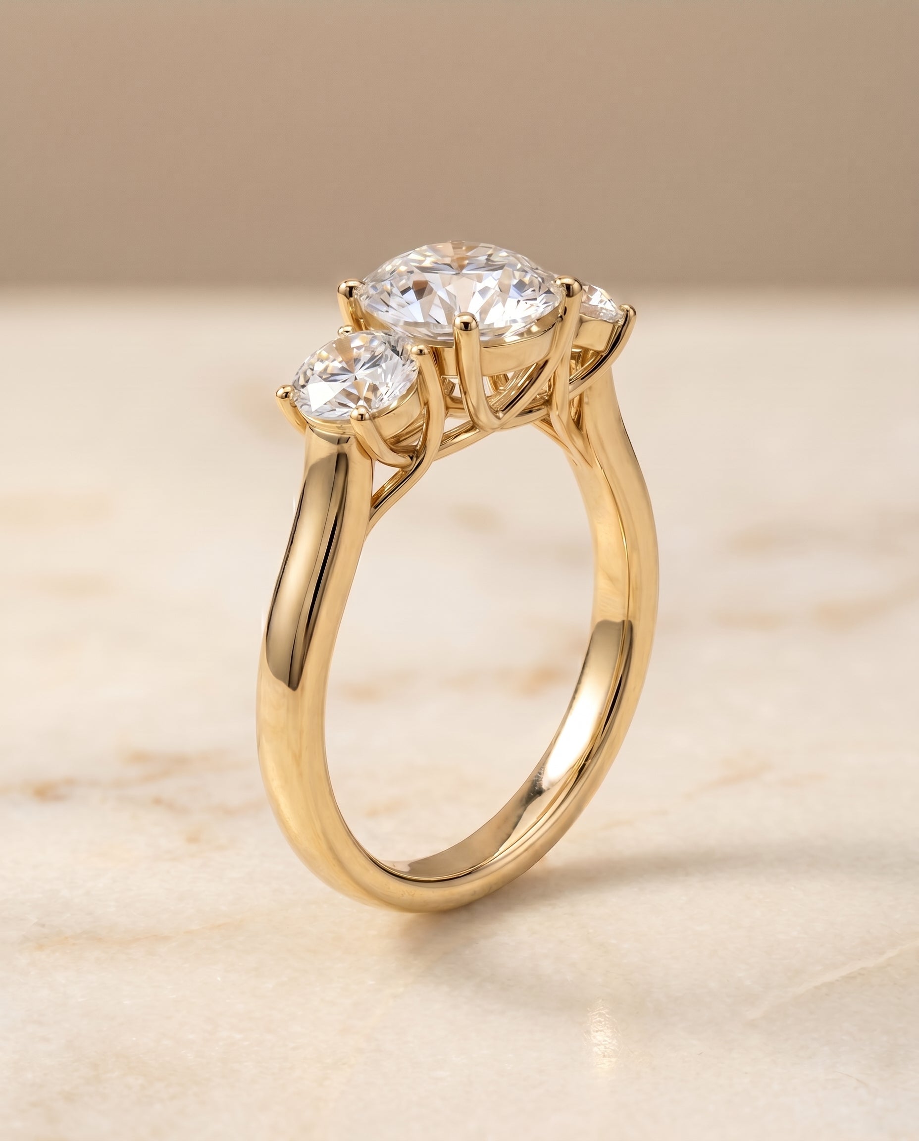 Classic Three Stone styling on The Natalie round engagement ring setting | RockHer
