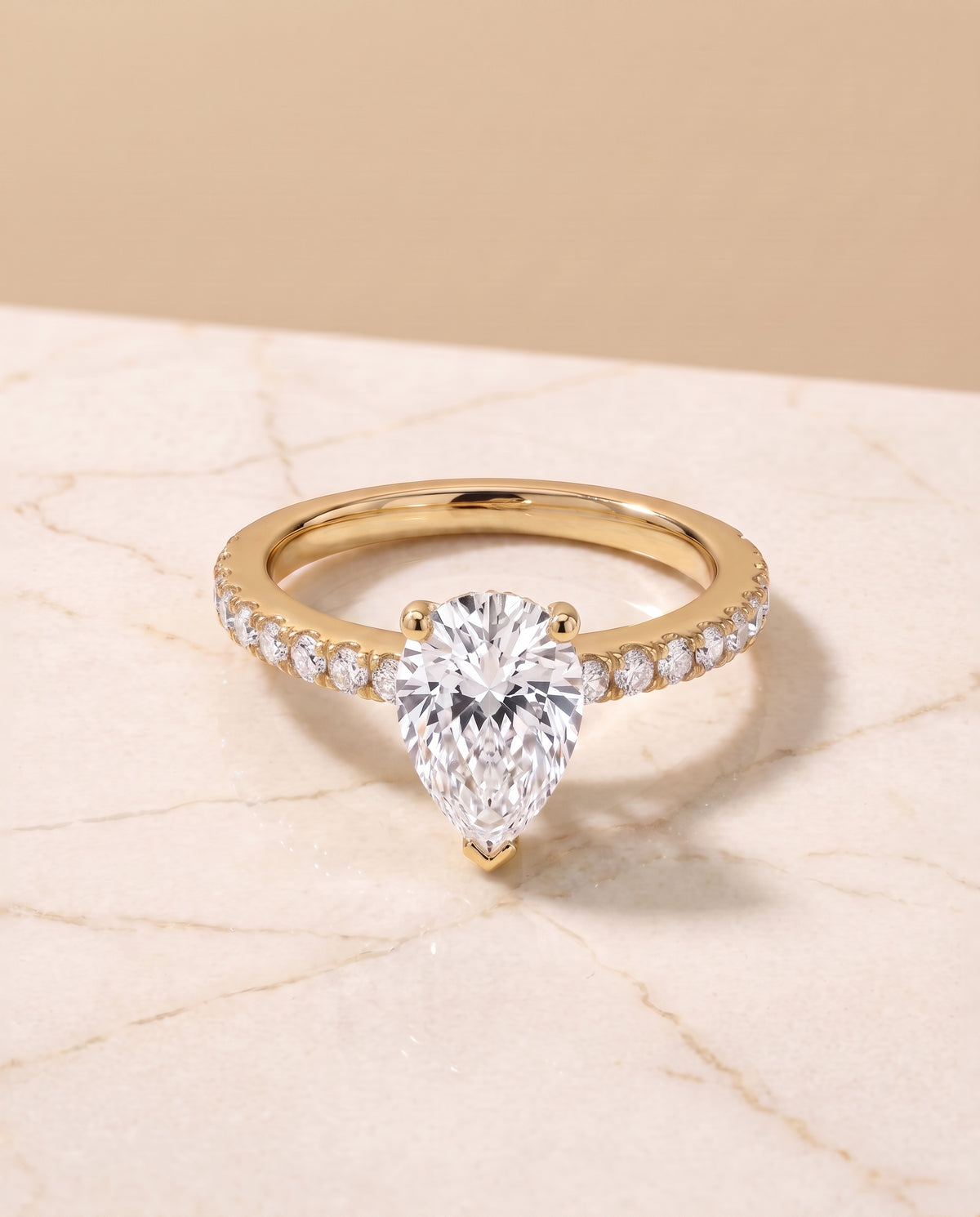 The Norah Classic Linear French Pavé Pear Engagement Ring Setting in 18K Yellow Gold