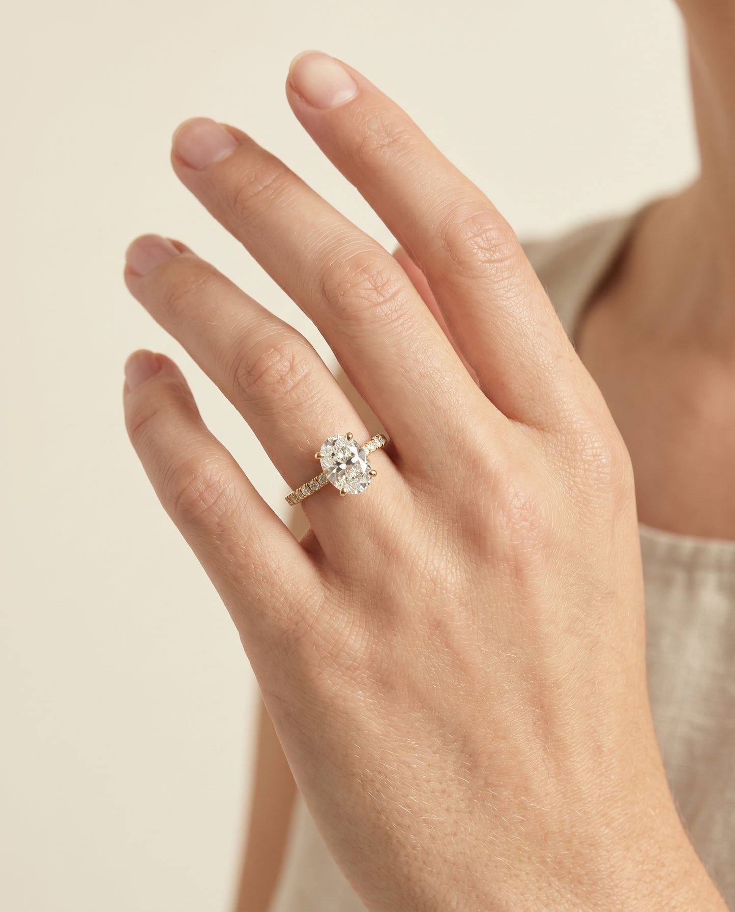 The Norah Classic Linear French Pavé Oval Engagement Ring Setting in 18K Yellow Gold