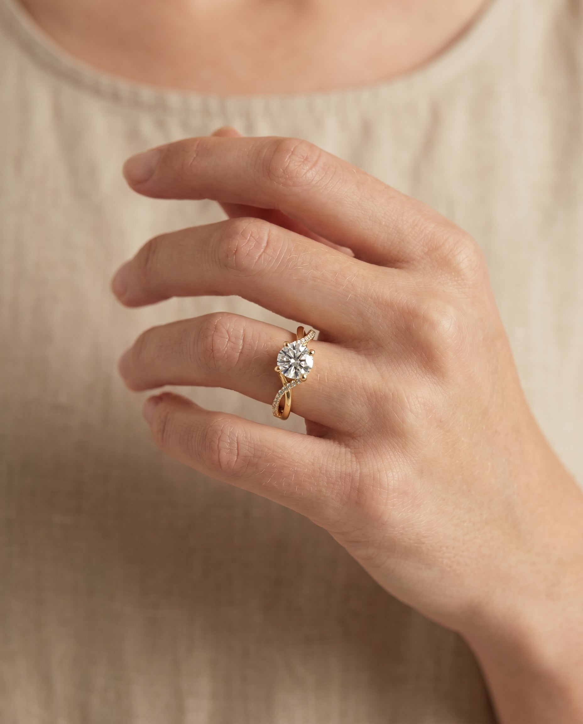 Ottava Select Bypass Pavé Twist Round Lab Diamond Engagement Ring in 18K Yellow Gold, shown on hand, angled | RockHer