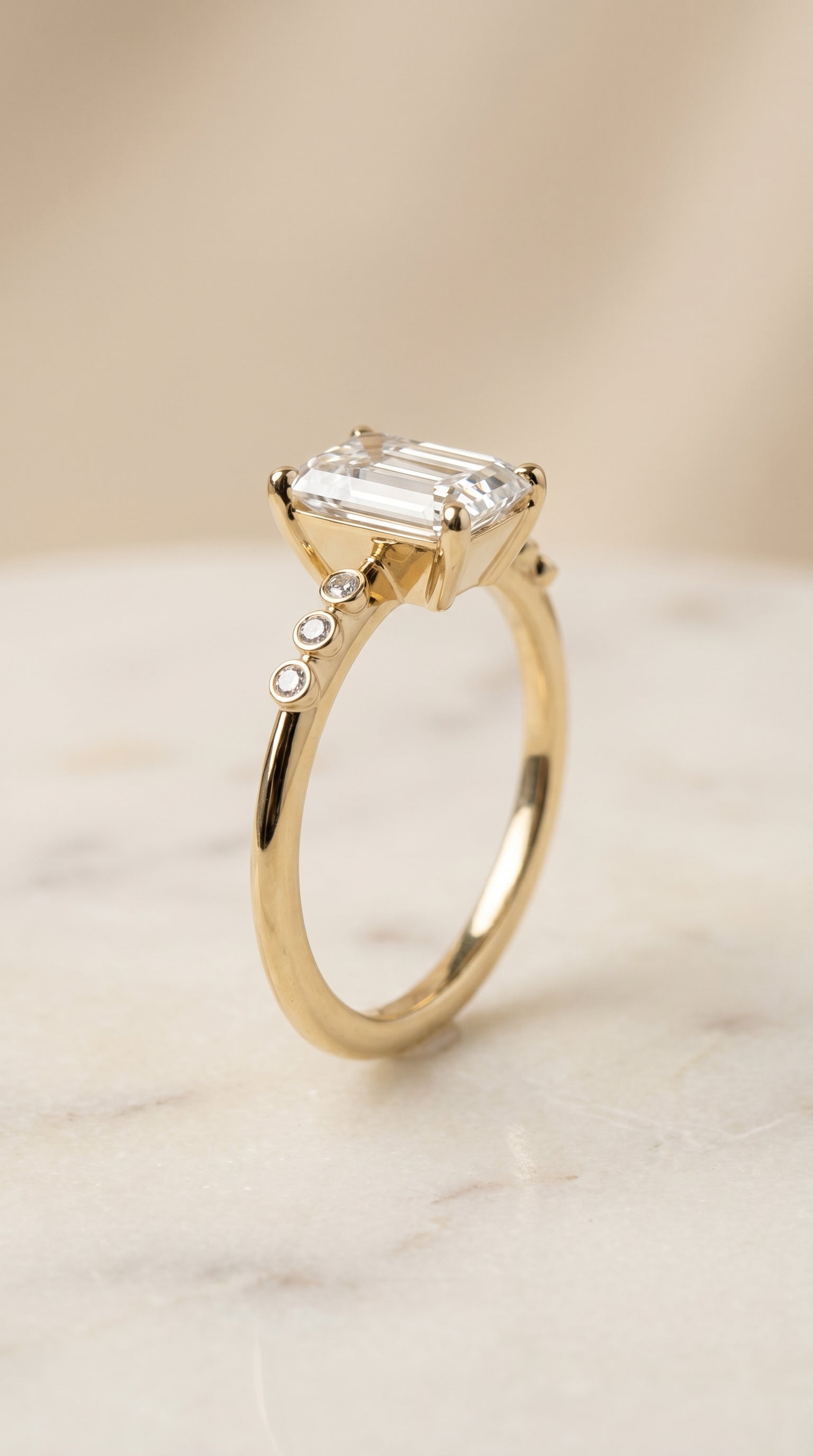 Bezel Accent Solitaire Cut styling on The Peggy emerald engagement ring setting | RockHer