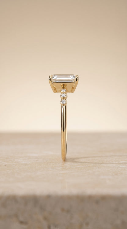 The Peggy Bezel Accent Solitaire Emerald Cut Engagement Ring Setting in 18K Yellow Gold
