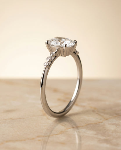 The Peggy Bezel Accent Solitaire Oval Engagement Ring Setting in 18K White Gold