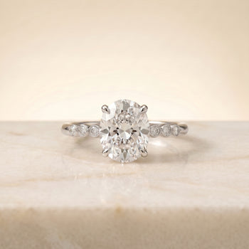 The Peggy Bezel Accent Solitaire Oval Engagement Ring Setting in Platinum