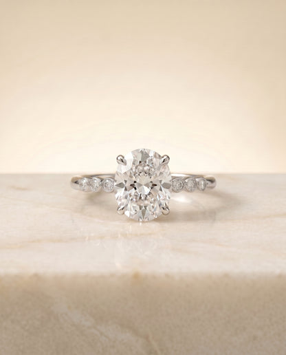 The Peggy Bezel Accent Solitaire Oval Engagement Ring Setting in 18K White Gold