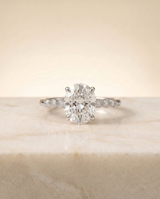The Peggy Bezel Solitaire Engagement Ring Setting for Oval Diamonds in Platinum