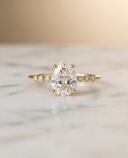 Peggy Select Bezel Accent Solitaire Princess Cut Lab Diamond Engagement Ring in 18K Yellow Gold, shown on hand, angled | RockHer