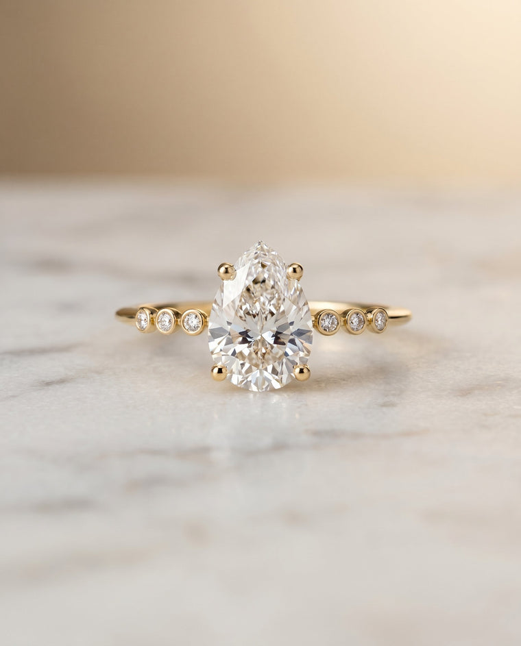 The Peggy Select Bezel Accent Solitaire Princess Cut Lab Diamond Engagement Ring in 18K Yellow Gold