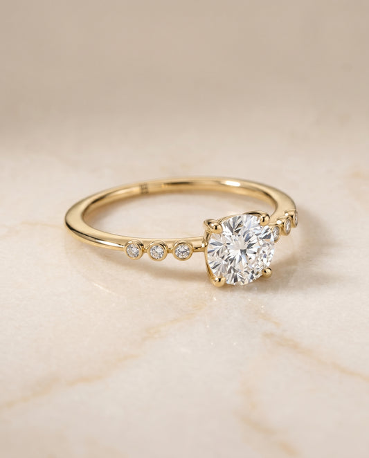 The Peggy Bezel Solitaire Engagement Ring Setting for Round Diamonds in 18K Yellow Gold