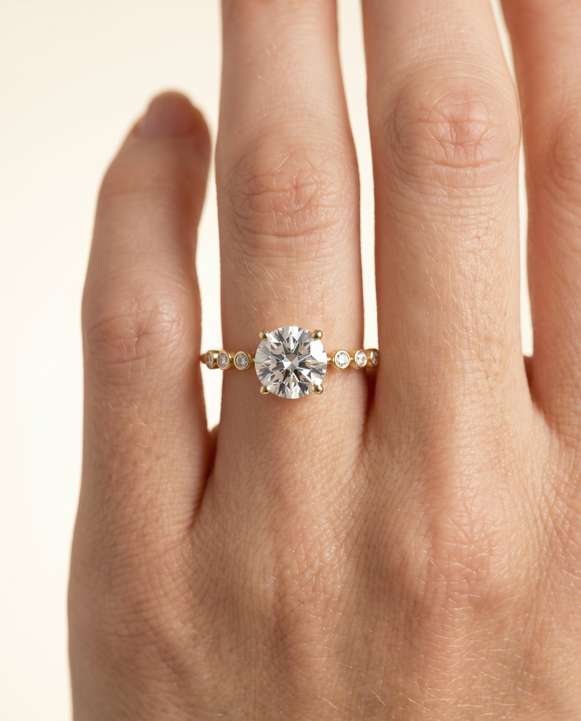 The Peggy engagement ring setting in 18K Yellow Gold, bezel accent solitaire design | RockHer