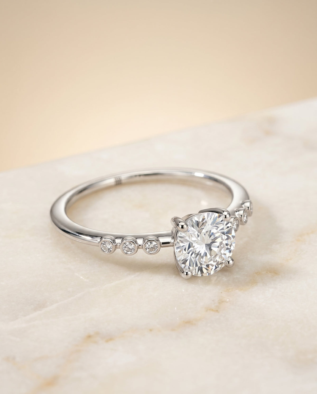 Peggy Select Bezel Accent Solitaire Round Lab Diamond Engagement Ring in 18K White Gold, alternate angle | RockHer