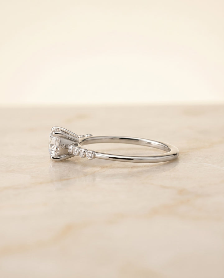 The Peggy Solitaire Engagement Ring Setting for Round Diamonds in 18K White Gold
