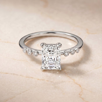 The Peggy Bezel Accent Solitaire Radiant Cut Engagement Ring Setting in 18K White Gold