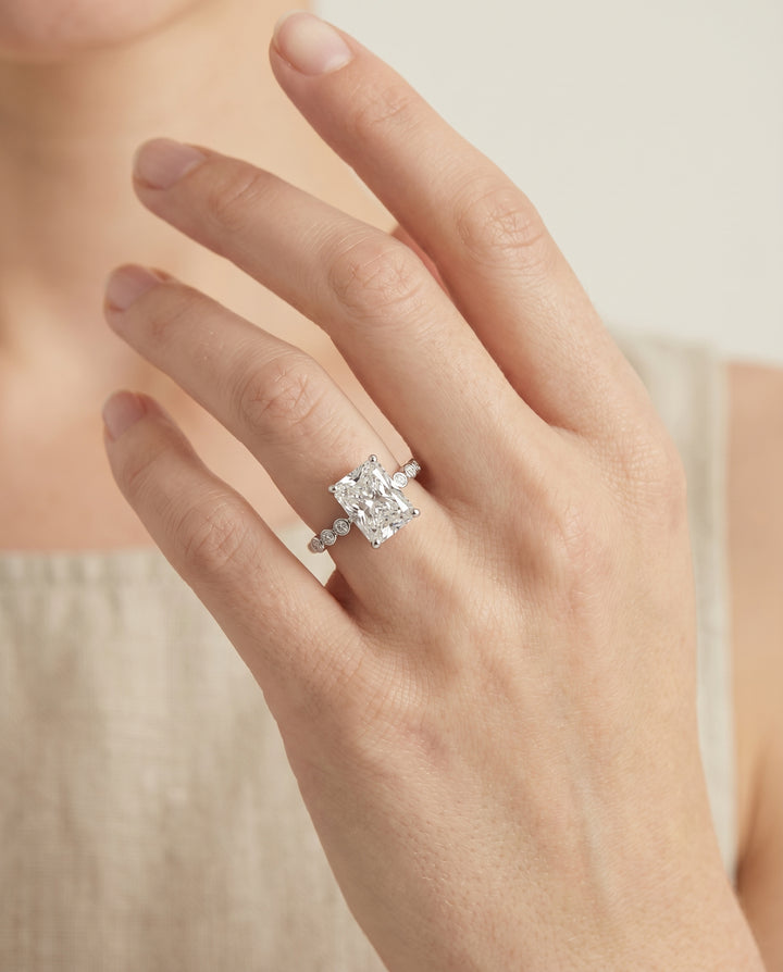 The Peggy Bezel Accent Solitaire Radiant Cut Engagement Ring Setting in Platinum