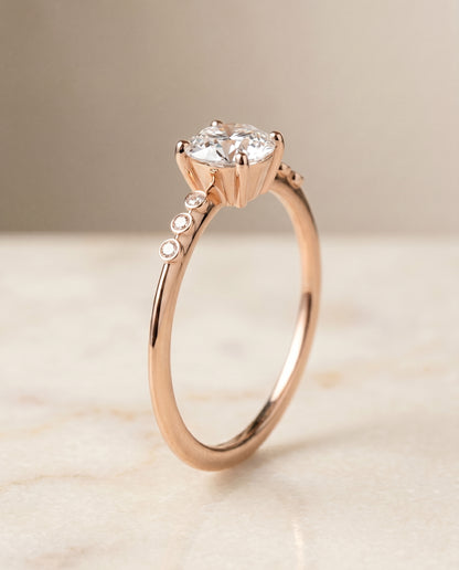 The Peggy Bezel Accent Solitaire Round Engagement Ring Setting in 14K Rose Gold