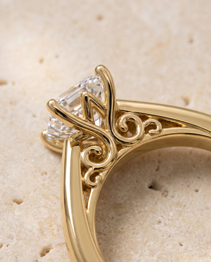 The Rio Scroll Gallery Comfort Fit Solitaire Asscher Cut Engagement Ring Setting in 18K Yellow Gold